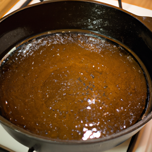 A Dutch oven being seasoned with a thin layer of oil.